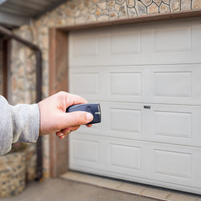 Lansing security key fob pointing to a garage door